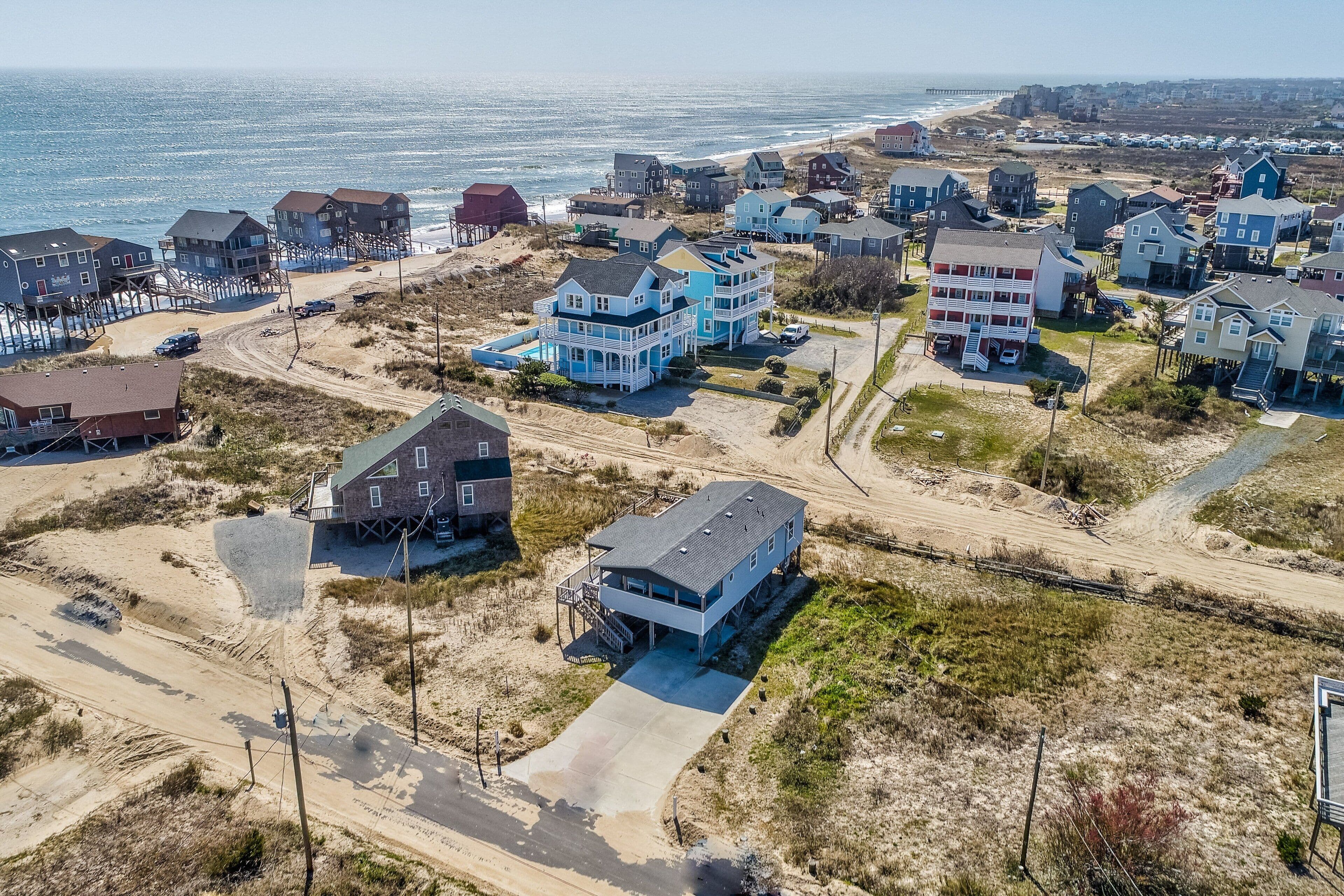 Ocean-view home steps from the beach with deck, outdoor shower, & central AC